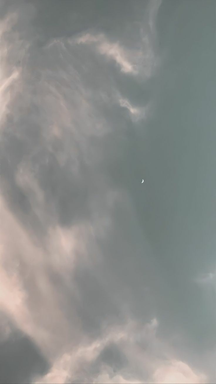 evening sky with moon, stars and clouds all visible during the afterglow